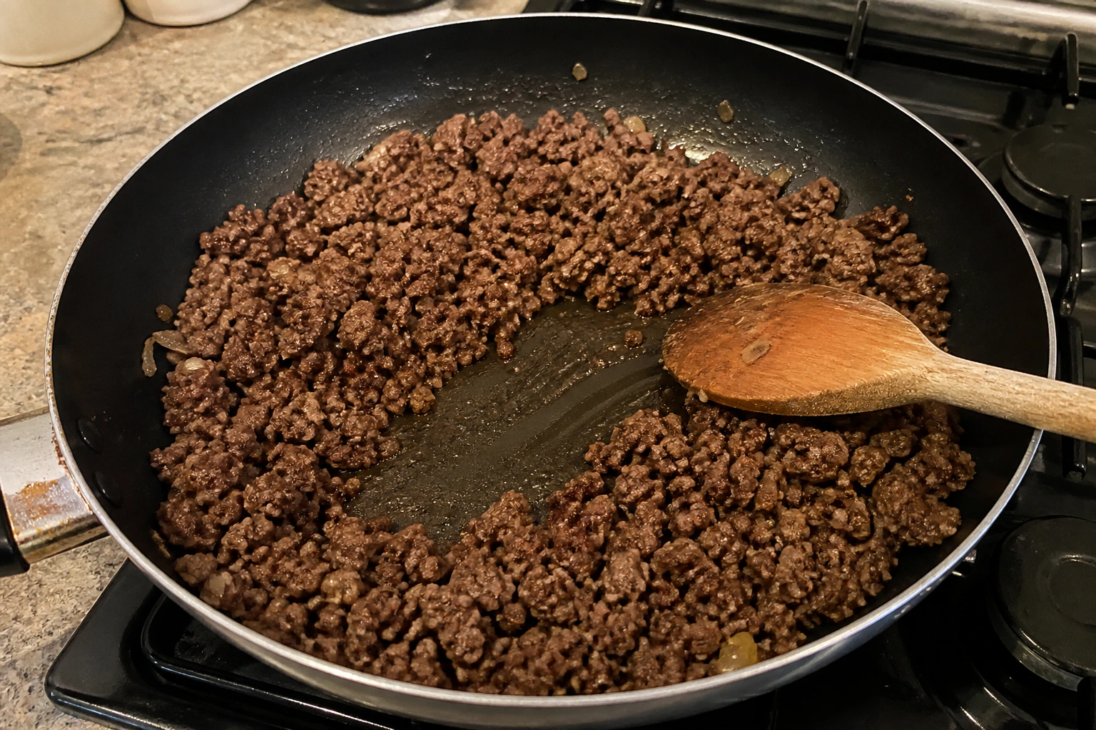 Finely broken beef mince properly browned with no watery liquid left in a wide kitchen pan