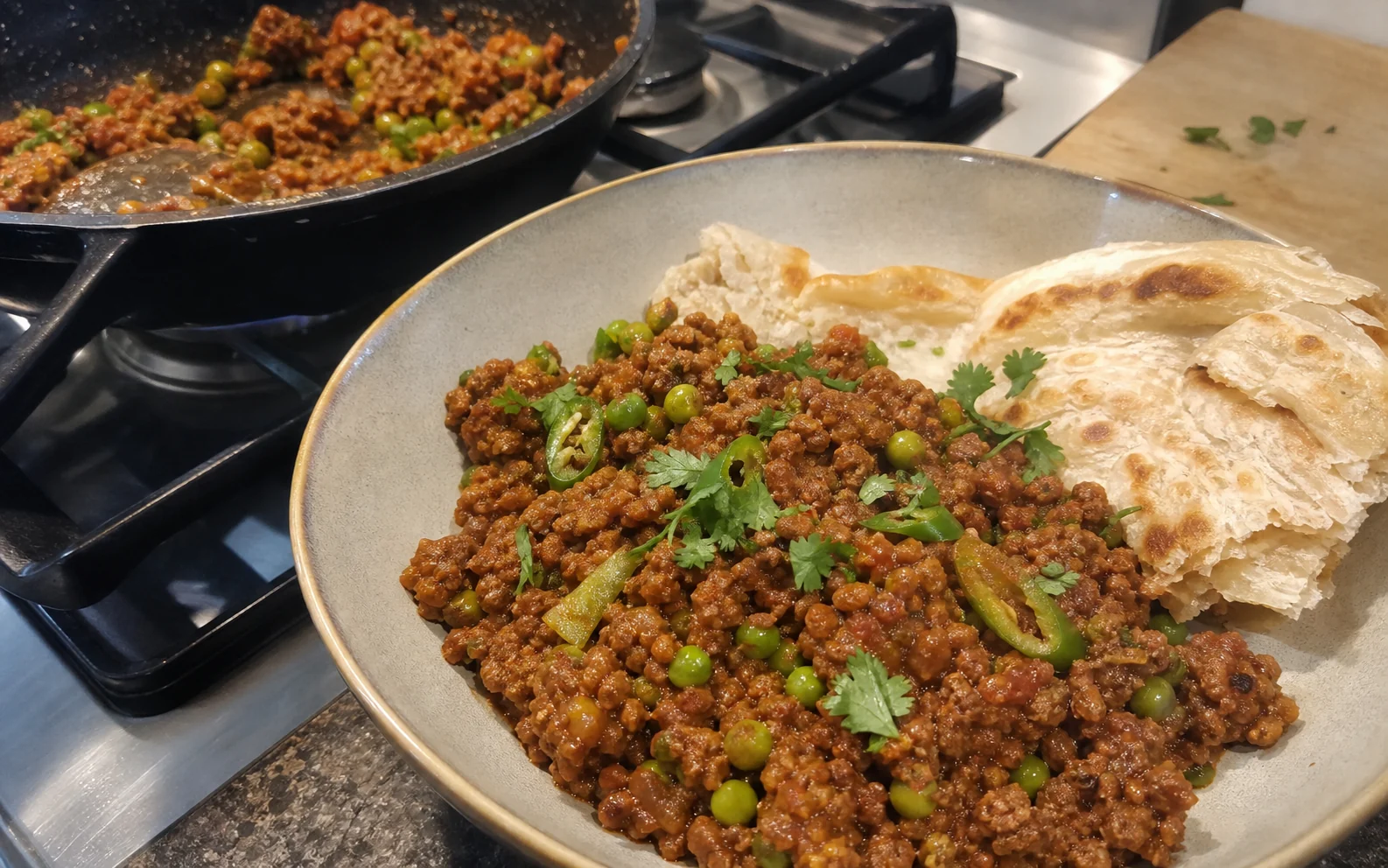 Thick keema with peas, green chilli and coriander served with torn paratha