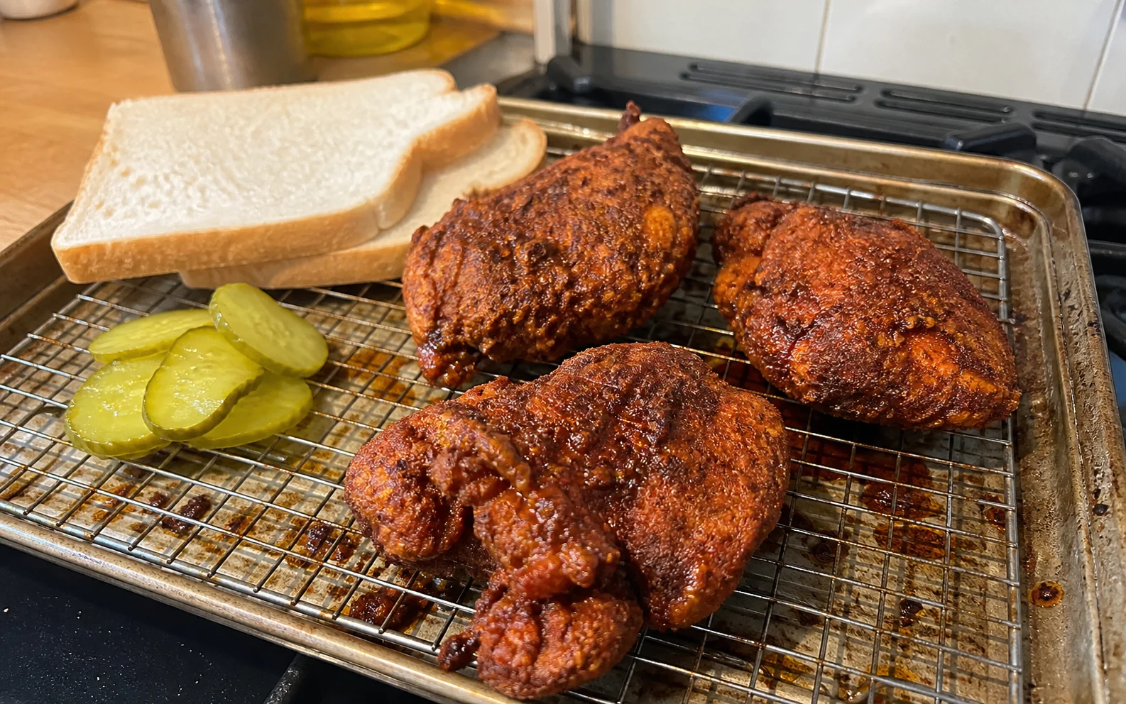 Craggy Nashville-style hot chicken with cayenne coating, plain bread and pickles